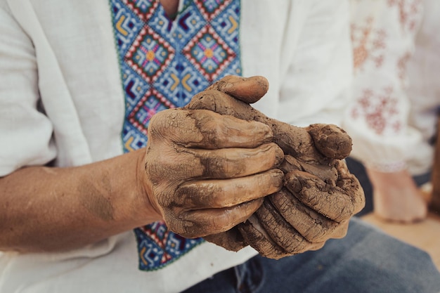 Piece of clay in hand