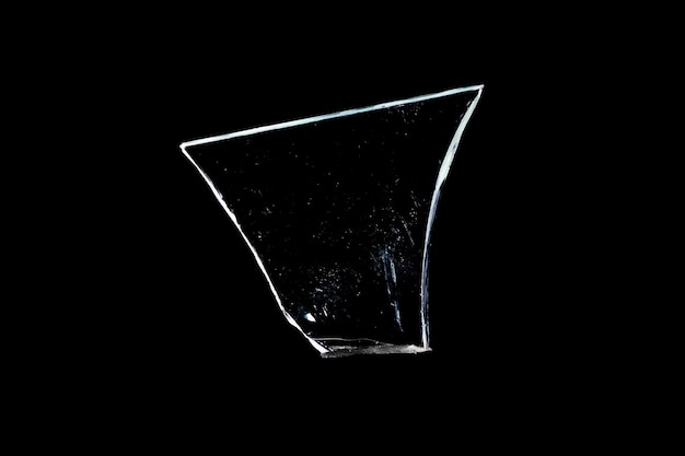 Photo piece of damaged glass isolated on black