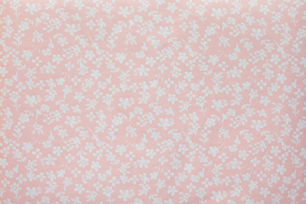 A piece of fabric with the image of small flowers in pastel colors