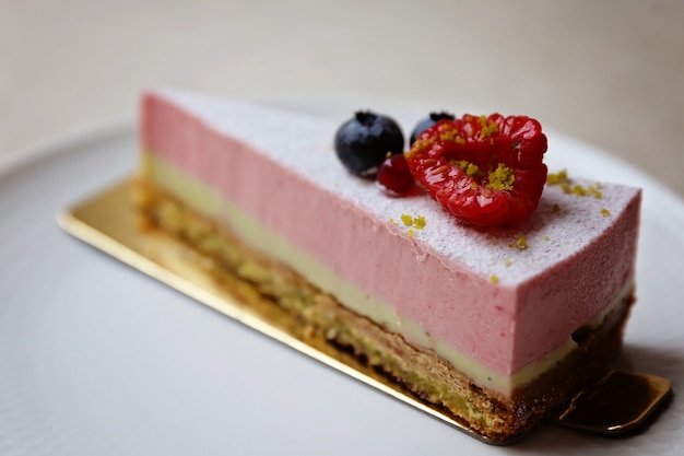 A piece of forest fruit cake on a plate