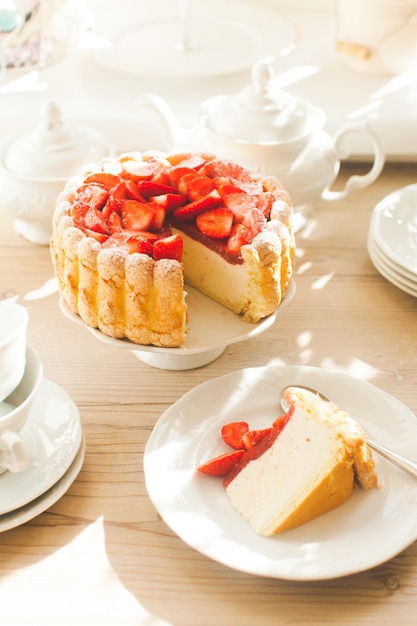 The piece of French Fresh Strawberry charlotteon the white plate