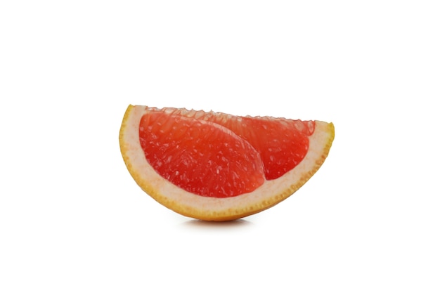 Piece of grapefruit isolated on white table