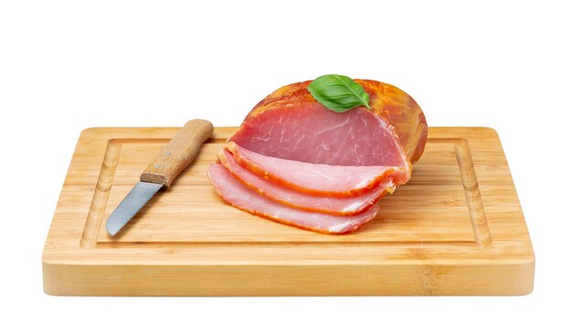 Piece of ham isolated on a white background Meat factory product closeup on cutting board