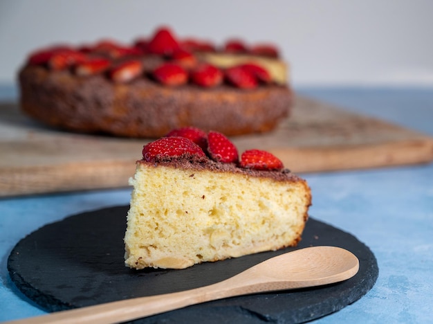 Piece of homemade cake with fresh strawberries