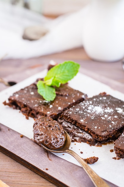 Piece of homemade chocolate brownies in a spoon