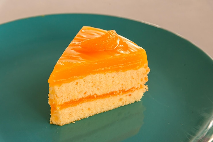 Photo オレンジのトッピングで自家製のオレンジケーキのピース