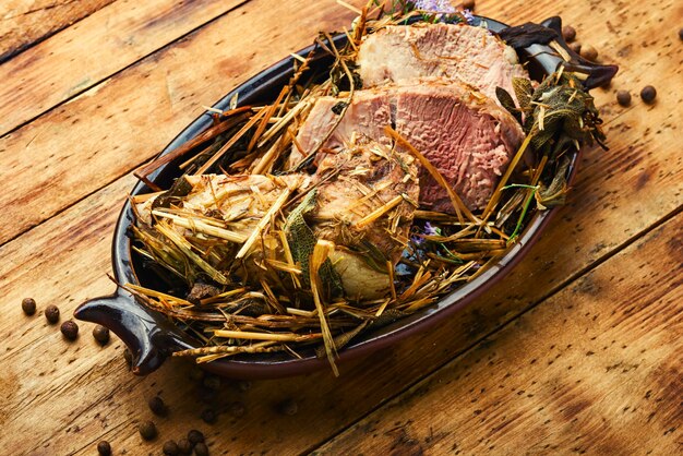 Piece of meat baked with fragrant herbs and spices