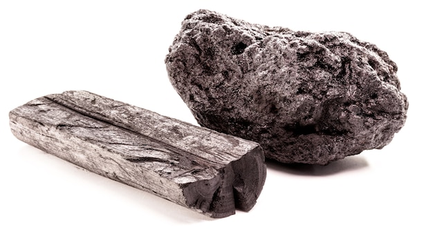 Piece of mineral coal and charcoal together, industrial fuel, with isolated white surface.