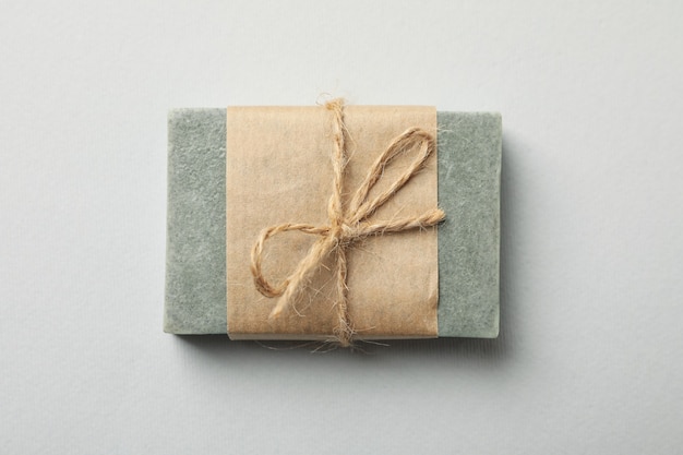 Piece of natural handmade soap on white