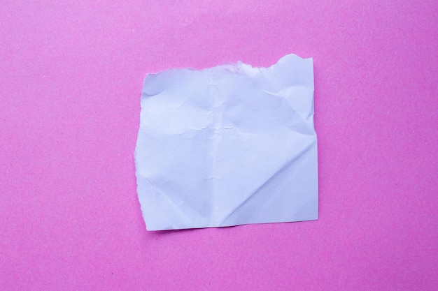 A piece of paper is folded into a square.