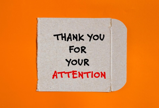 a piece of paper that says thank you for your attention