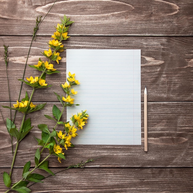 a piece of paper with a notepad and a pen on it.