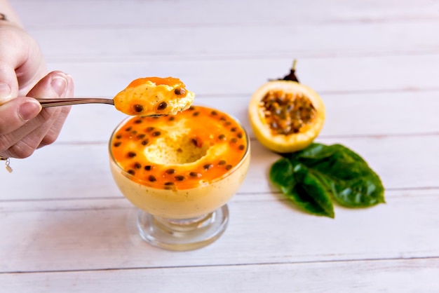 Piece of passion fruit mousse on spoon