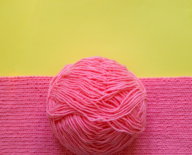 Piece of pink knitting yarn wool