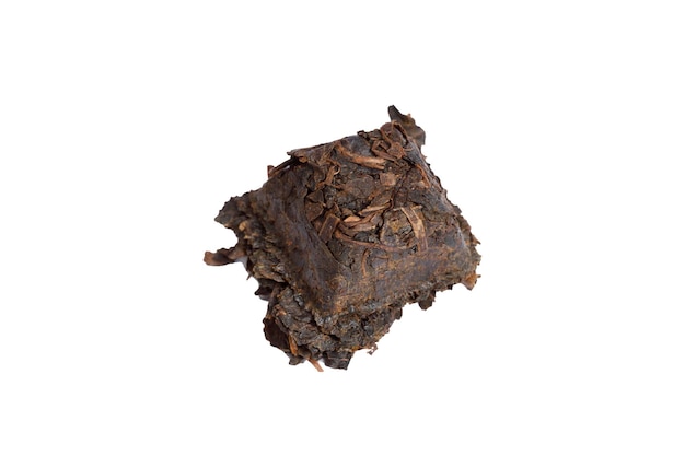 A piece of Puer tea is isolated on a white background. High quality photo
