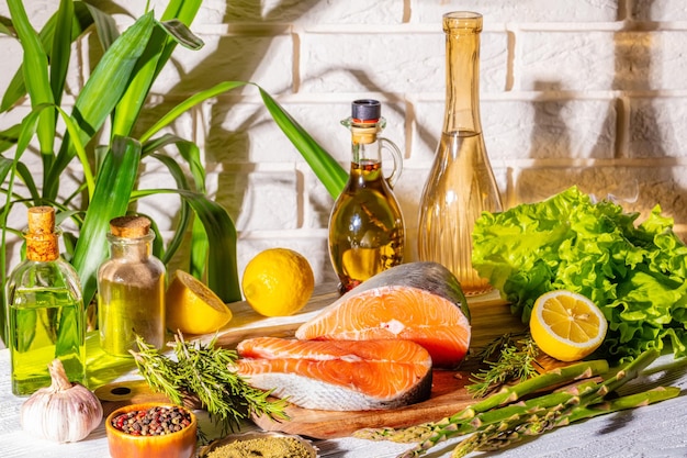 Piece of raw salmon fish with spices and herbs