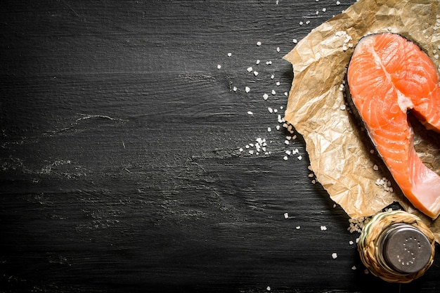 Piece of raw salmon with salt