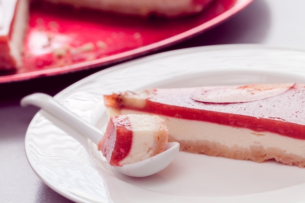 A piece of red cheesecake