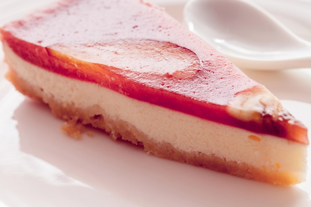 A piece of red cheesecake