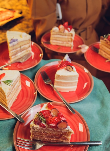 A piece of strawberry cake served on a white plate redy to eat