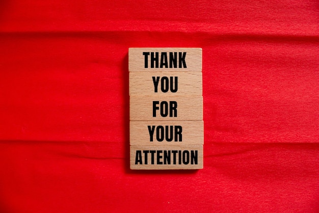 a piece of wood with the words thank you for your attention