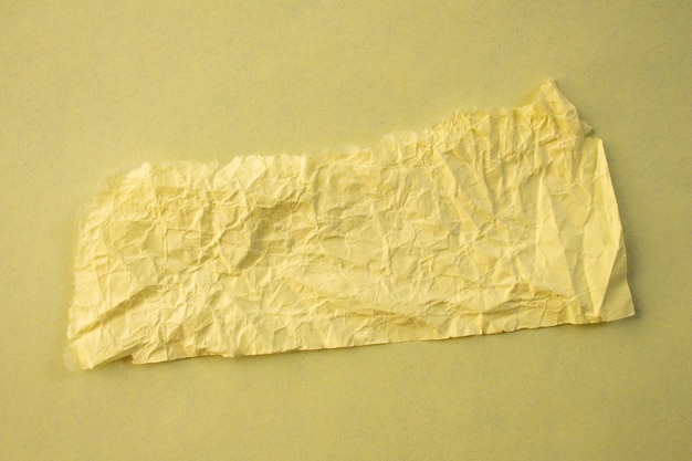 A piece of yellow paper with the word paper on it