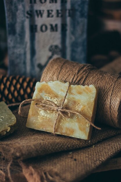 Pieces of beautiful natural handcrafted soap on wooden table