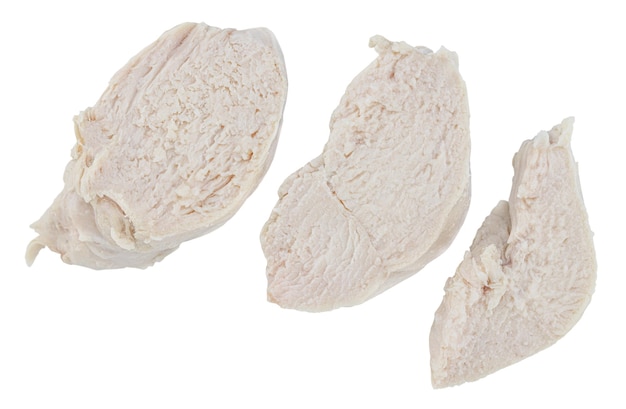 Pieces of boiled chicken breast isolated on white background