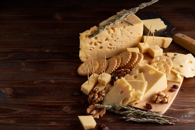 Pieces of cheese, nuts, raisins, snacks for wine. Appetitive Copy space