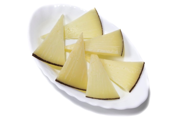 Pieces of cheeses served on a plate isolated on white background Concept of the best cheeses