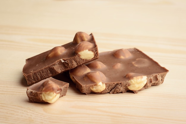 Pieces of chocolate bar with a lot of hazelnuts