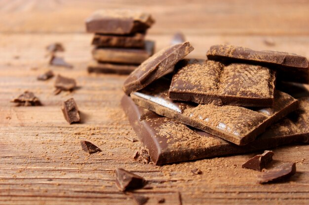 Pieces of chocolate on the table closeup