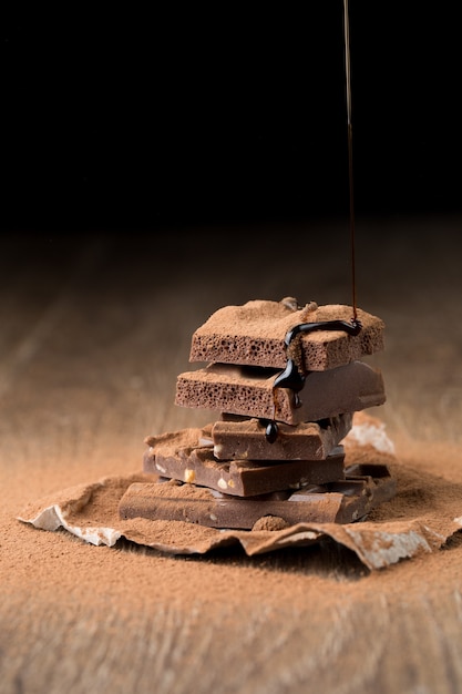 Pieces of chocolate on table