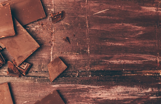 Pieces of chocolate with crumbs on the left