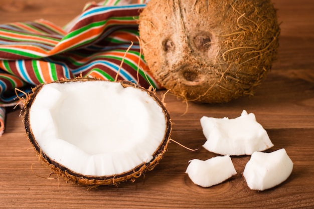 Pieces of coconut on a wooden table