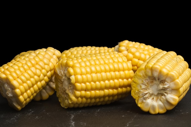 Pieces of corns on a dark background