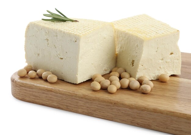 Pieces of delicious tofu with rosemary and soy on white background