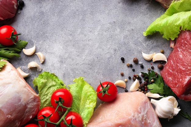 Photo pieces of different fresh meat on kitchen table