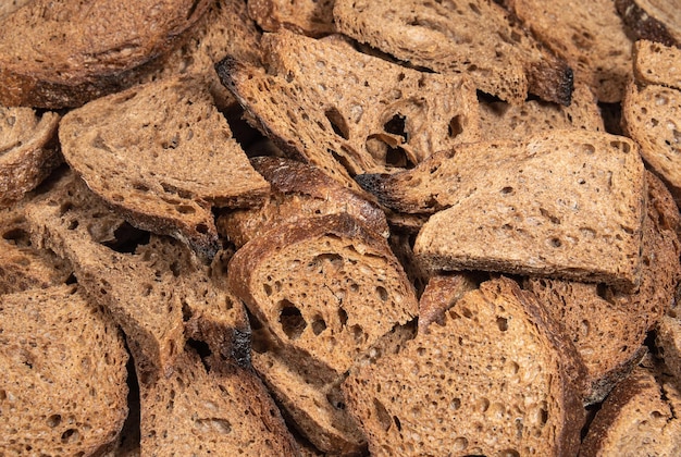 Pieces of dry black bread close up Food and bakery products
