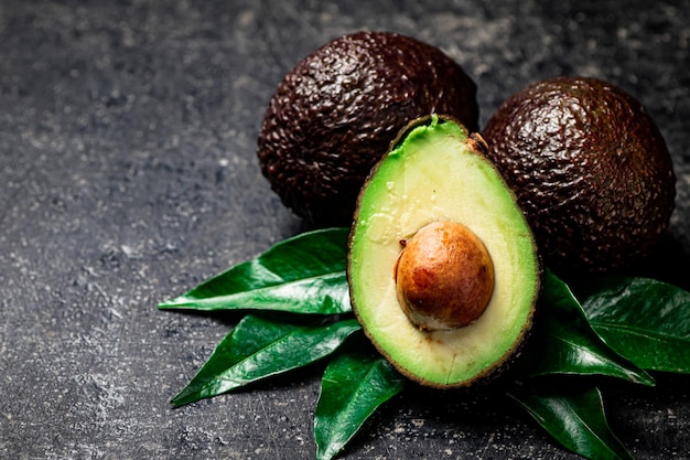 Pieces of fresh avocado with leaves