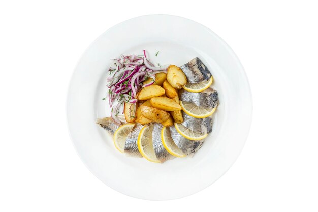 Pieces of herring in potatoes and onions in a plate Appetizing traditional snack Top view Closeup Isolated on white background