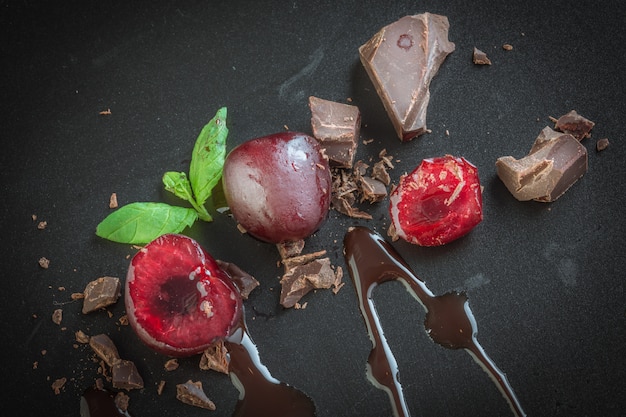 Photo pieces of milk chocolate and cherries