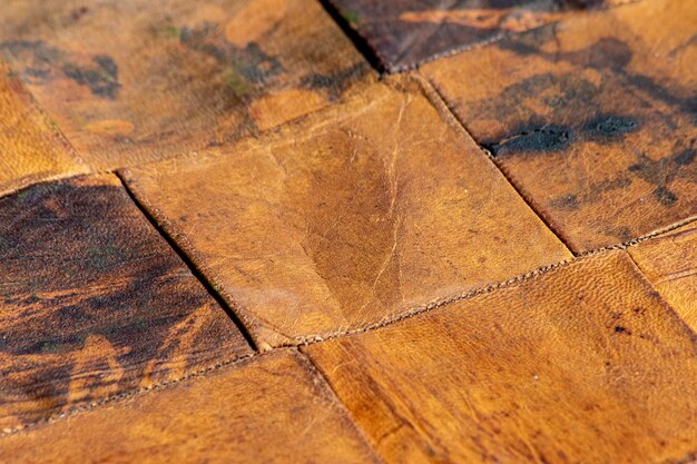 Pieces of old leather combined together in bright diagonal pattern