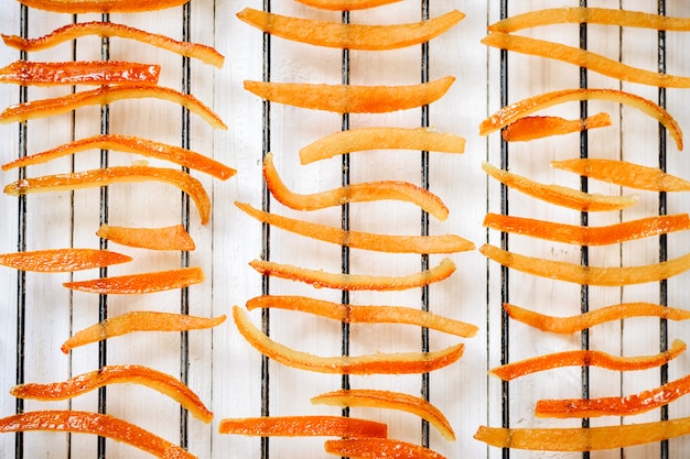 Pieces of orange peel dried on a grill