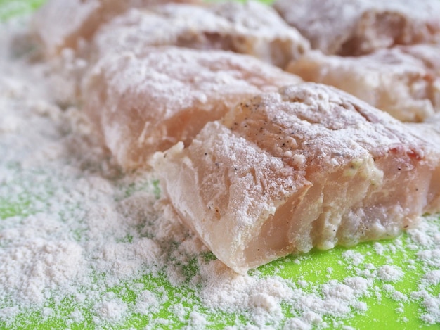 Pieces of organic fish fillet in breadcrumbs. Close up.