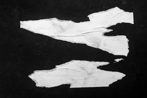 A pieces of paper on a black wall