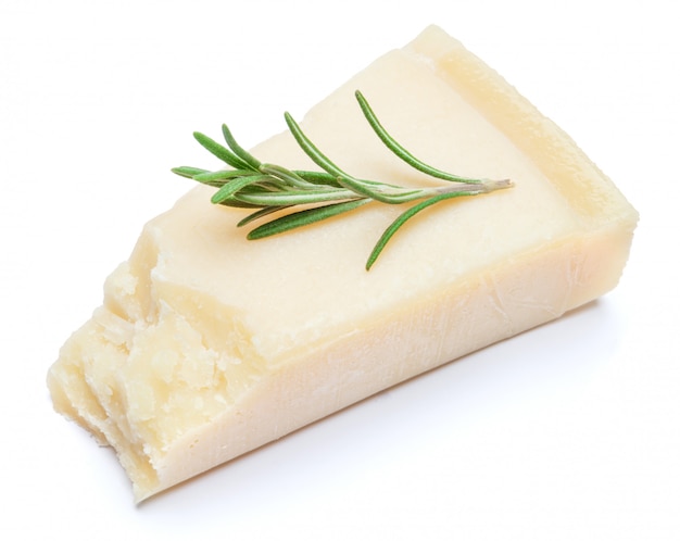 Pieces of Parmesan cheese on white table