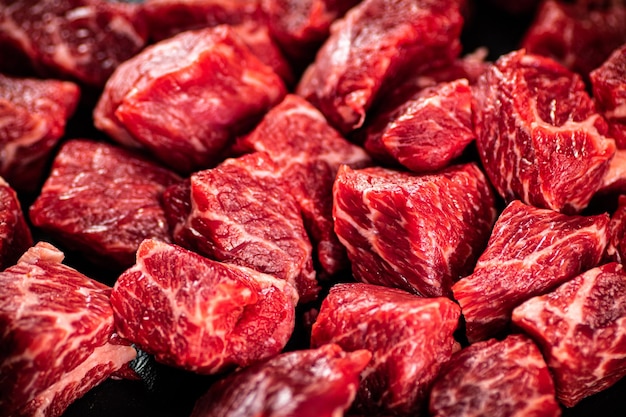 pieces of raw beef macro background