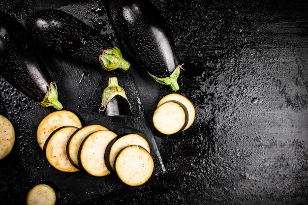Pieces of ripe eggplant on a stone board