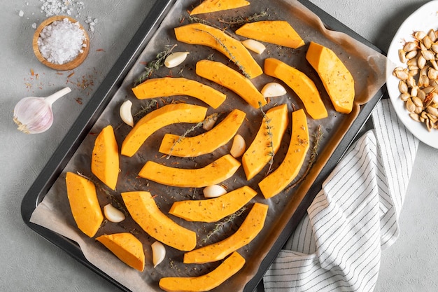 Pieces of ripe pumpkin prepared for baking in the oven